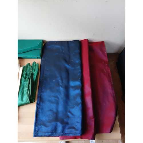 97 - A job lot of vintage women's accessories, to include; silk gloves, a purse, a bag, and table runners... 