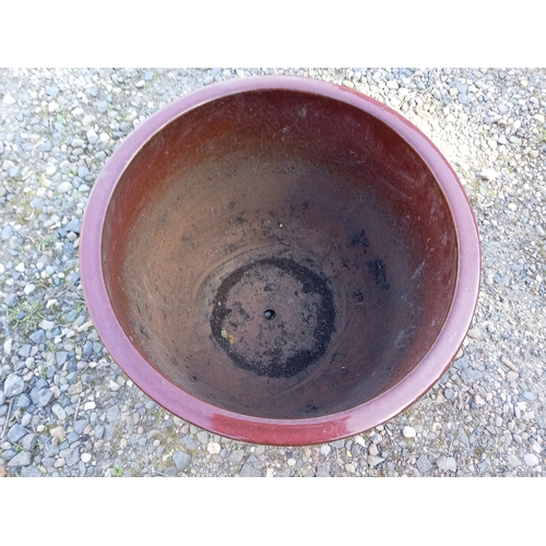 119 - A large blood rec glazed ceramic plant pot. (Height 38 cm x, Diameter 41 cm)