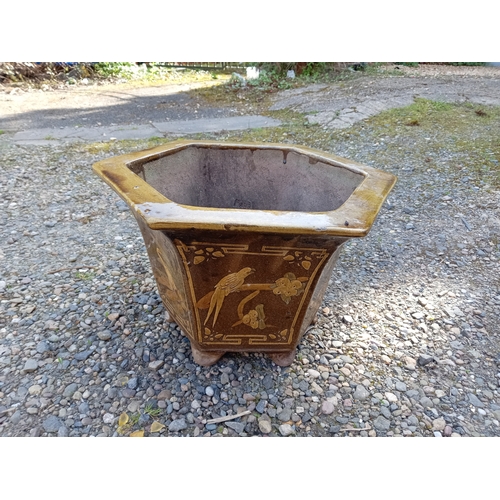 120 - A large japanese glazed ceramic hexagonal pot depicting birds. (Height 32 cm X Diameter 54 cm)