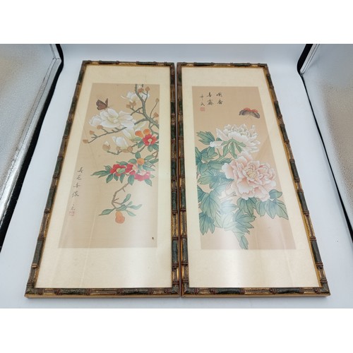 109 - A pair of Chinese silk paintings depicting fruit & flowers (Height 52 cm x Width 22 cm).