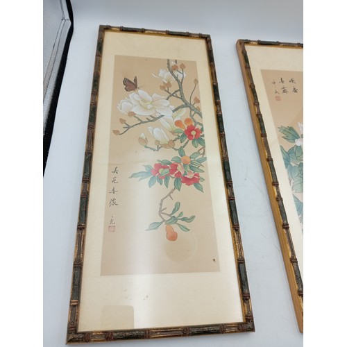 109 - A pair of Chinese silk paintings depicting fruit & flowers (Height 52 cm x Width 22 cm).