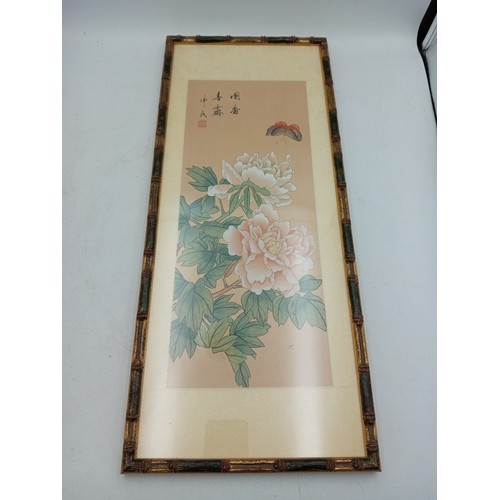 109 - A pair of Chinese silk paintings depicting fruit & flowers (Height 52 cm x Width 22 cm).