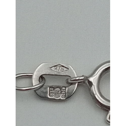 402 - A stamped 375 9ct white gold necklace. Weight 1.38 grams.
