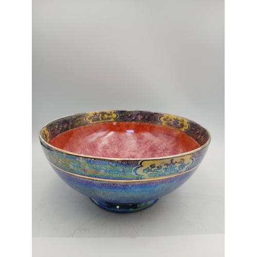 9 - A pair of ceramics influding an oriental style maling newcastle on tyne bowl and a floral crown duca... 