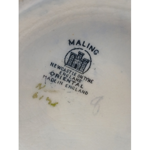 9 - A pair of ceramics influding an oriental style maling newcastle on tyne bowl and a floral crown duca... 