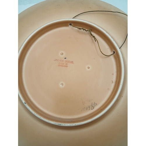 9 - A pair of ceramics influding an oriental style maling newcastle on tyne bowl and a floral crown duca... 