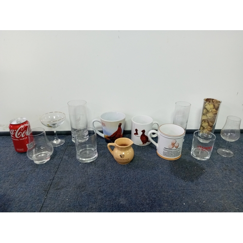 10 - A collection of mugs & glasses. To include brands The famous grouse, babycham, glenmorangie, Grants ... 