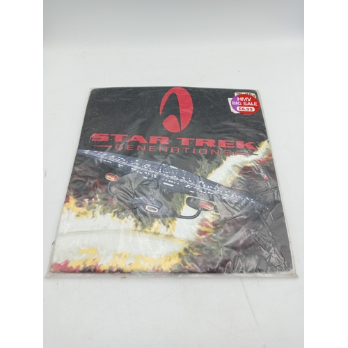 12 - A Star Trek Generations T-Shirt, brand new in orginal packaging. Size XL.
