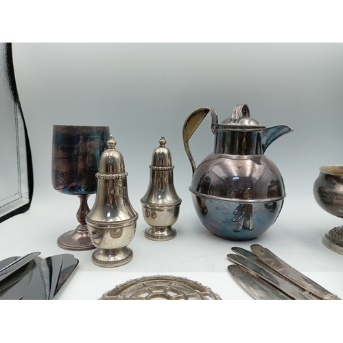 13 - A box of odds. To include Silver plate, glass paper weight, cutlery, Lorus men's wrist watch, etc...