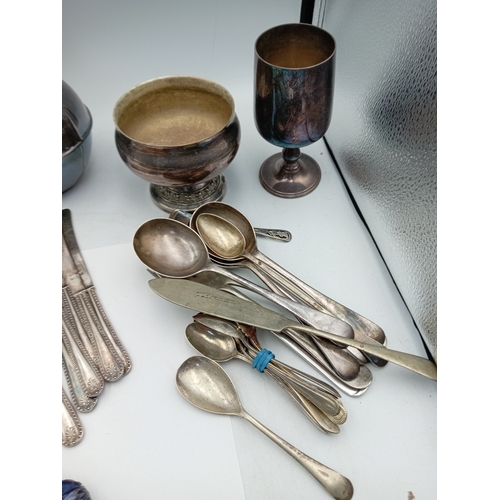 13 - A box of odds. To include Silver plate, glass paper weight, cutlery, Lorus men's wrist watch, etc...