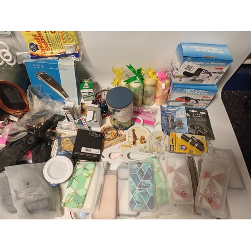 14 - A large job lot of car boot items. Featuring, phone cases, candles, torches, electrical items and mo... 