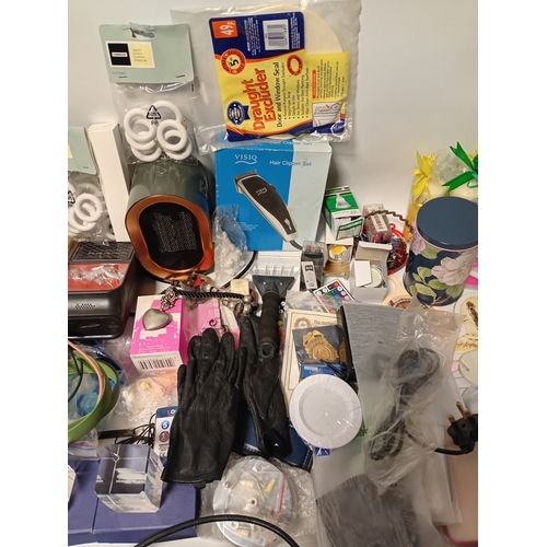 14 - A large job lot of car boot items. Featuring, phone cases, candles, torches, electrical items and mo... 