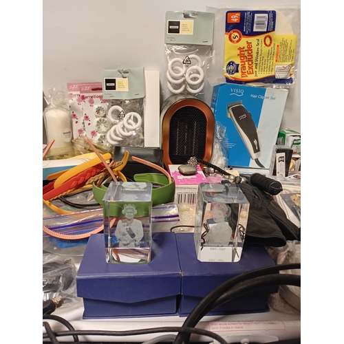 14 - A large job lot of car boot items. Featuring, phone cases, candles, torches, electrical items and mo... 