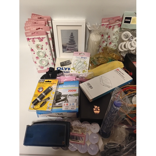 14 - A large job lot of car boot items. Featuring, phone cases, candles, torches, electrical items and mo... 