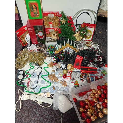 17 - A job lot of Christmas decorations. Featuring, lights, tree decorations, window stickers, an LED Wav... 
