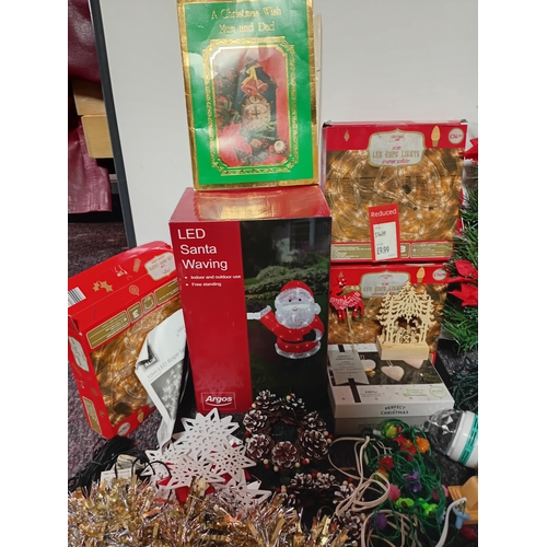 17 - A job lot of Christmas decorations. Featuring, lights, tree decorations, window stickers, an LED Wav... 