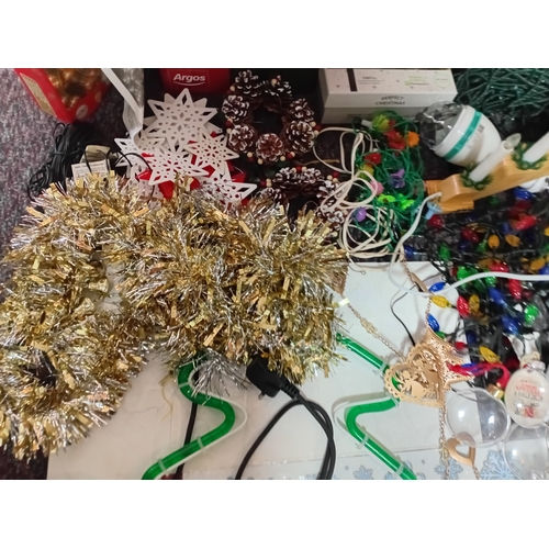 17 - A job lot of Christmas decorations. Featuring, lights, tree decorations, window stickers, an LED Wav... 