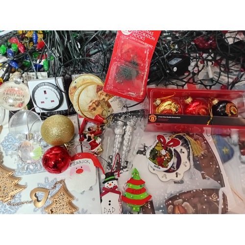 17 - A job lot of Christmas decorations. Featuring, lights, tree decorations, window stickers, an LED Wav... 