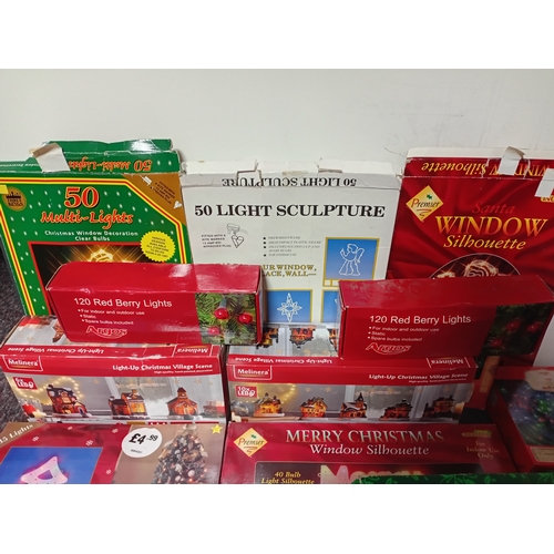 18 - A job lot of Christmas decorations. Featuring, lights, ornaments, a 24 hour timer switch, a candle, ... 