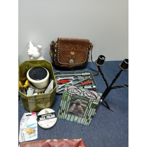 23 - A box of odds. To include leather bag, Tiffany style photo frame, cut glass, document tray, candelab... 