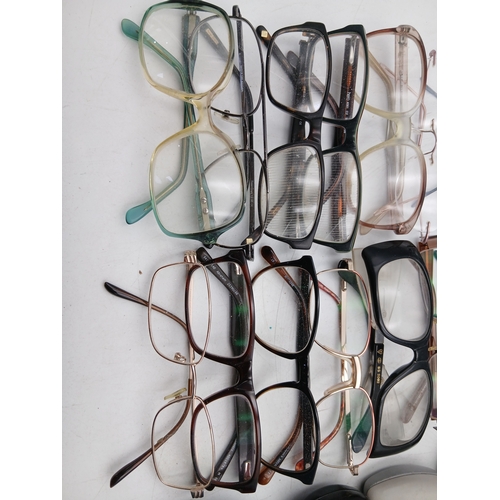 24 - A job lot of glasses with names such as foster grant, hero, allegro frame, impressions and specsaver... 
