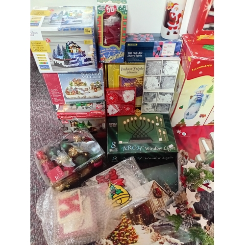 25 - A job lot of Christmas decorations. Featuring, lights, ornaments, a Nativity set, tree decorations, ... 