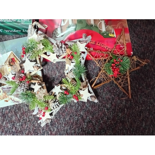 25 - A job lot of Christmas decorations. Featuring, lights, ornaments, a Nativity set, tree decorations, ... 
