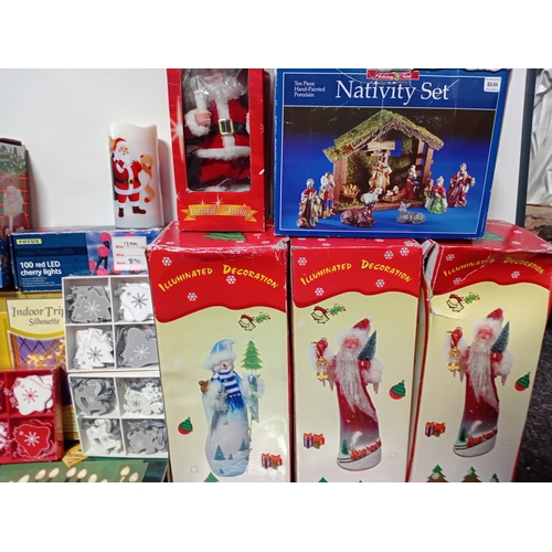25 - A job lot of Christmas decorations. Featuring, lights, ornaments, a Nativity set, tree decorations, ... 