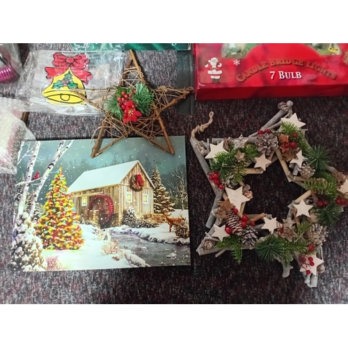 25 - A job lot of Christmas decorations. Featuring, lights, ornaments, a Nativity set, tree decorations, ... 