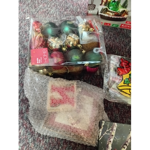 25 - A job lot of Christmas decorations. Featuring, lights, ornaments, a Nativity set, tree decorations, ... 