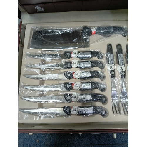 31 - A vintage Breitenbach Solingen deluxe cutlery set housed in a locking briefcase with a certificate a... 