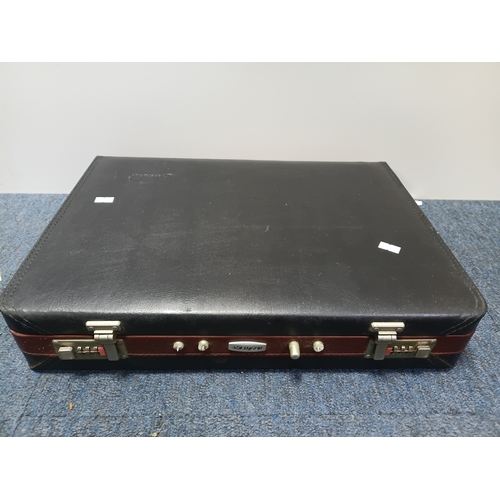 31 - A vintage Breitenbach Solingen deluxe cutlery set housed in a locking briefcase with a certificate a... 