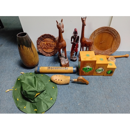 32 - A collection of decorative wooden items including carved figures of animals , people , dishes and a ... 