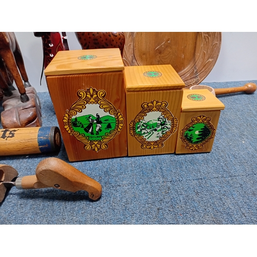 32 - A collection of decorative wooden items including carved figures of animals , people , dishes and a ... 