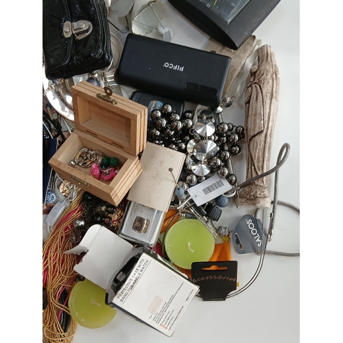 33 - A job lot to include jewellery, perfumes, phone accessories and much more.