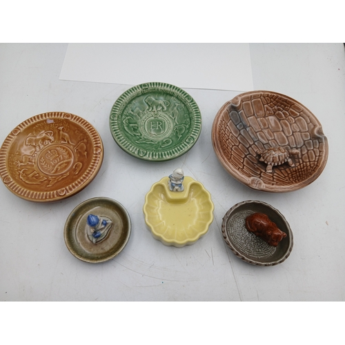38 - A collection of ceramic Wade bowls or ash trays and trinket dishes featuring an england coronation 1... 