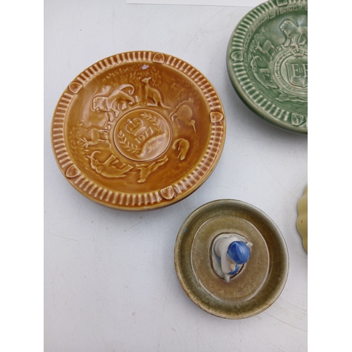 38 - A collection of ceramic Wade bowls or ash trays and trinket dishes featuring an england coronation 1... 