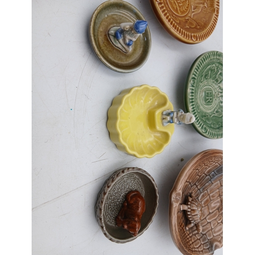 38 - A collection of ceramic Wade bowls or ash trays and trinket dishes featuring an england coronation 1... 