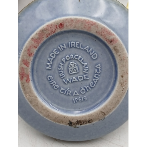 38 - A collection of ceramic Wade bowls or ash trays and trinket dishes featuring an england coronation 1... 