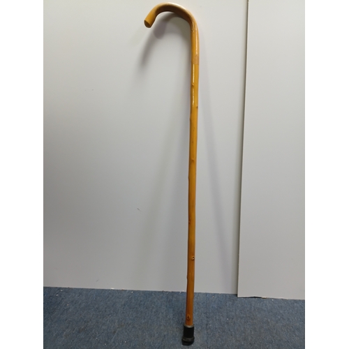 40 - A collection of walking sticks and umbrellas, with brands such as Dunlop, Lambert and Butler, Burtel... 