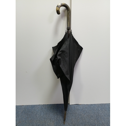 40 - A collection of walking sticks and umbrellas, with brands such as Dunlop, Lambert and Butler, Burtel... 