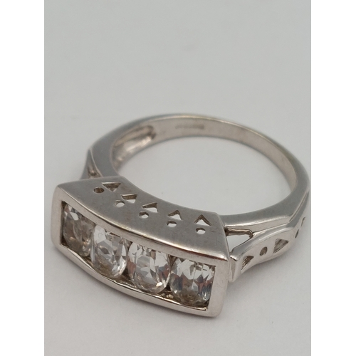 397 - A hallmarked 375 9ct white gold wide band ring set with white stones. Size N. Total weight 5.3g