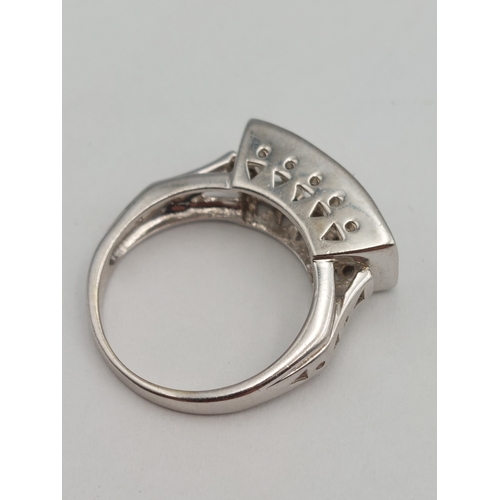 397 - A hallmarked 375 9ct white gold wide band ring set with white stones. Size N. Total weight 5.3g