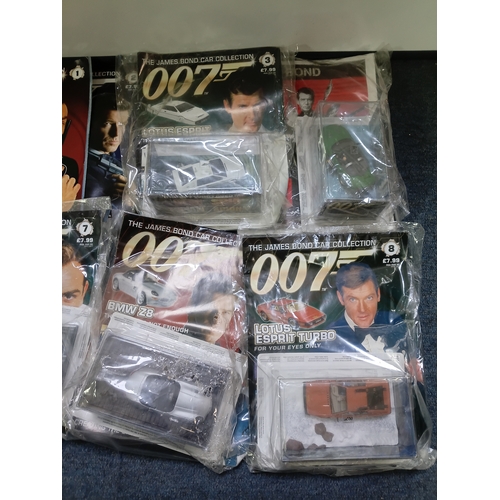 151 - A collection of 007 James bond magazine and cars some of which include; citron 2cv, BMW z8, lotus es... 