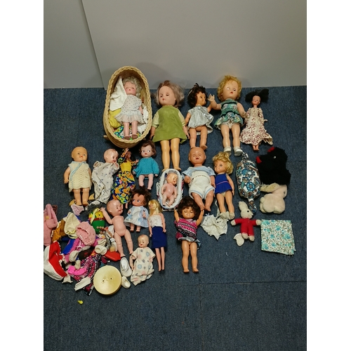 153 - A job lot of dolls and barbies with accessories such as clothes, shoes, hairclips and more.