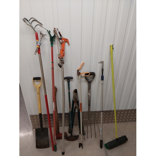 45 - A collection of gardening tools to include spade, axe, pruners, tree loppers etc.