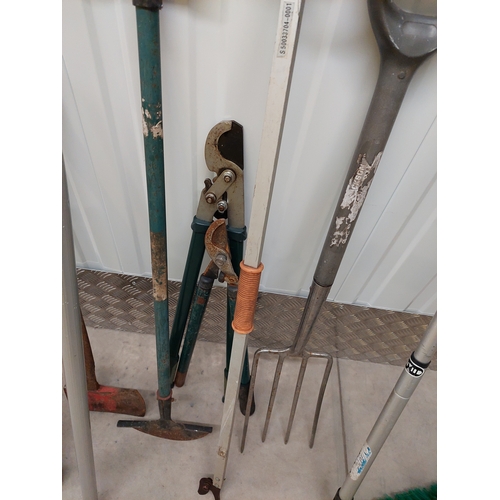 45 - A collection of gardening tools to include spade, axe, pruners, tree loppers etc.