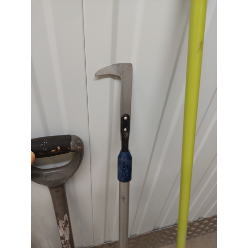 45 - A collection of gardening tools to include spade, axe, pruners, tree loppers etc.