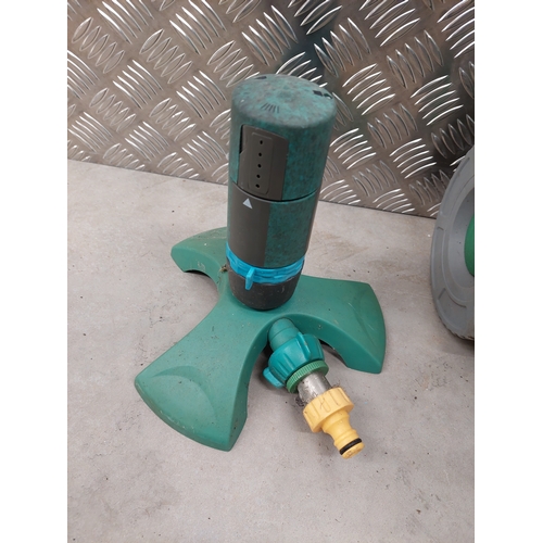 46 - A hozelock deluxe auto kit together with hose reel and sprinkler attachment. All appears present in ... 
