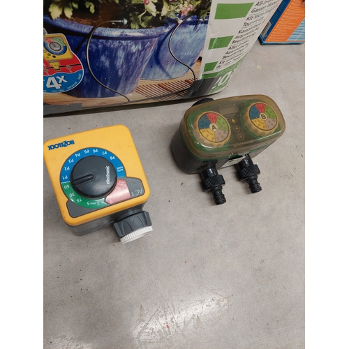 46 - A hozelock deluxe auto kit together with hose reel and sprinkler attachment. All appears present in ... 